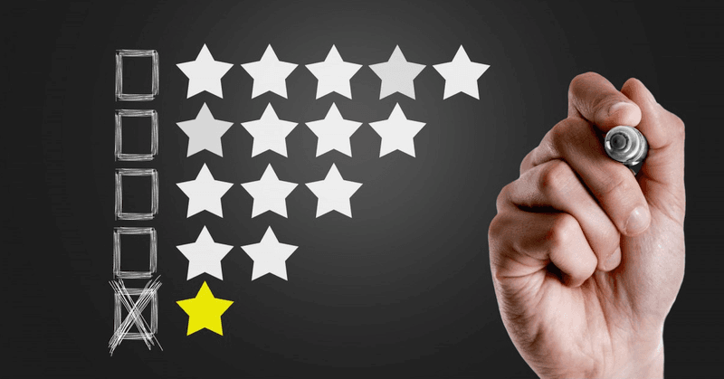 Hand drawing an unchecked fifth star in a row of four stars, with a single yellow star at the bottom.